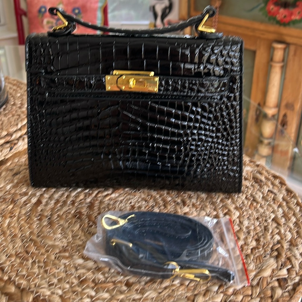 kelly bag small crocodile texture 7”h x 93/4”w @ bottom has crossbody strap
